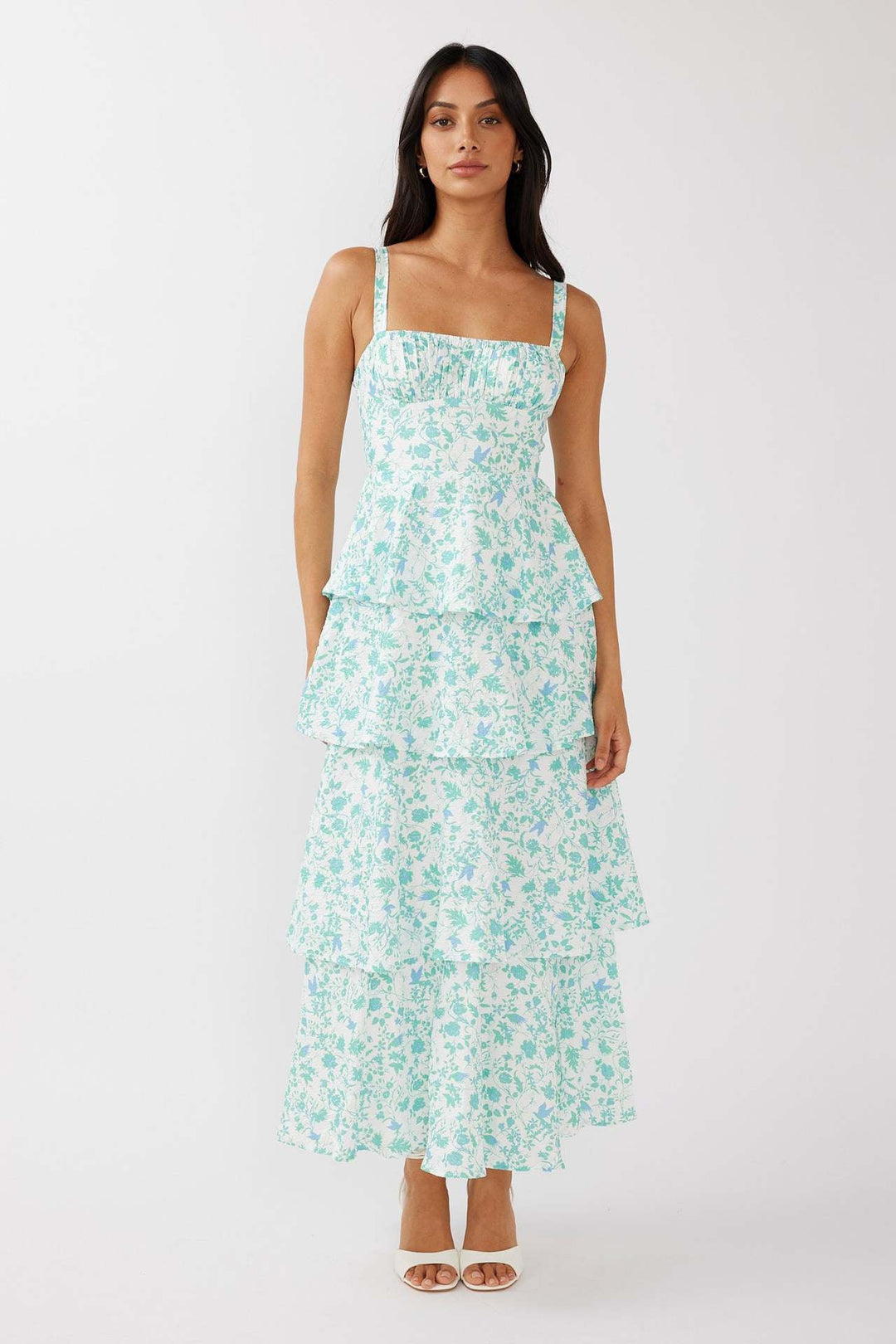 Stylish women's summer floral midi dress featuring a sleeveless design and elegant ruffled hem.