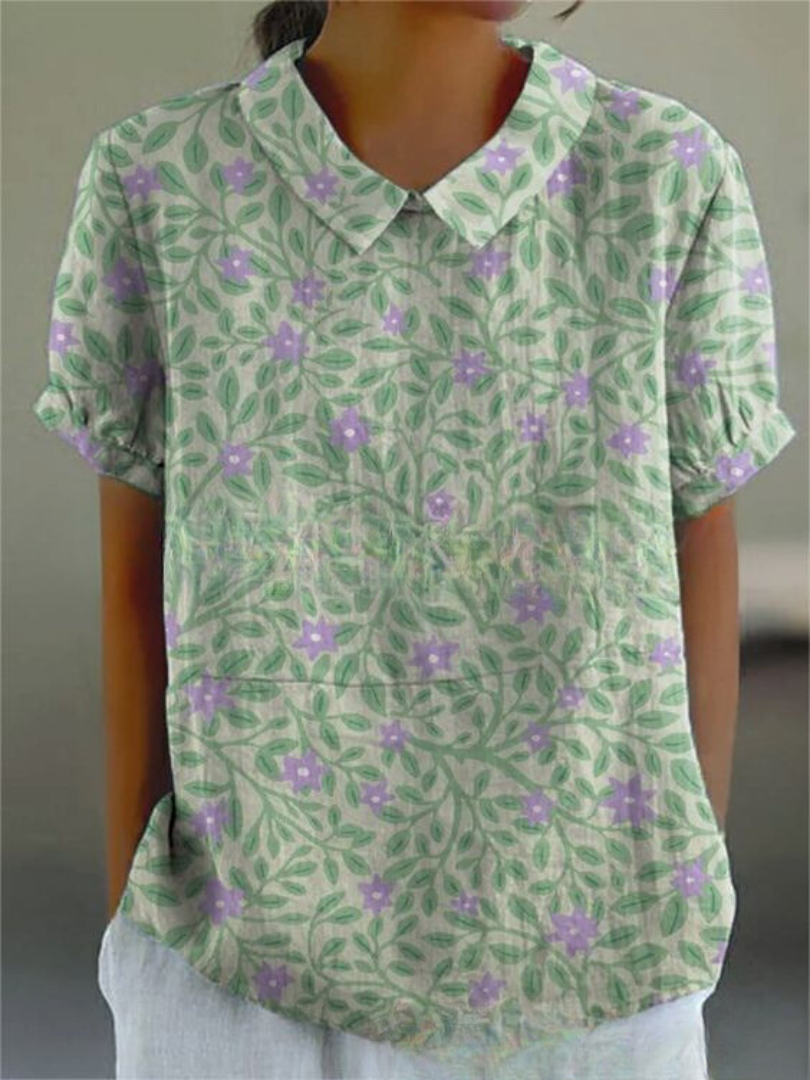 Women's patterned shirt with a feminine floral design and a timeless Peter Pan collar, perfect for daytime.