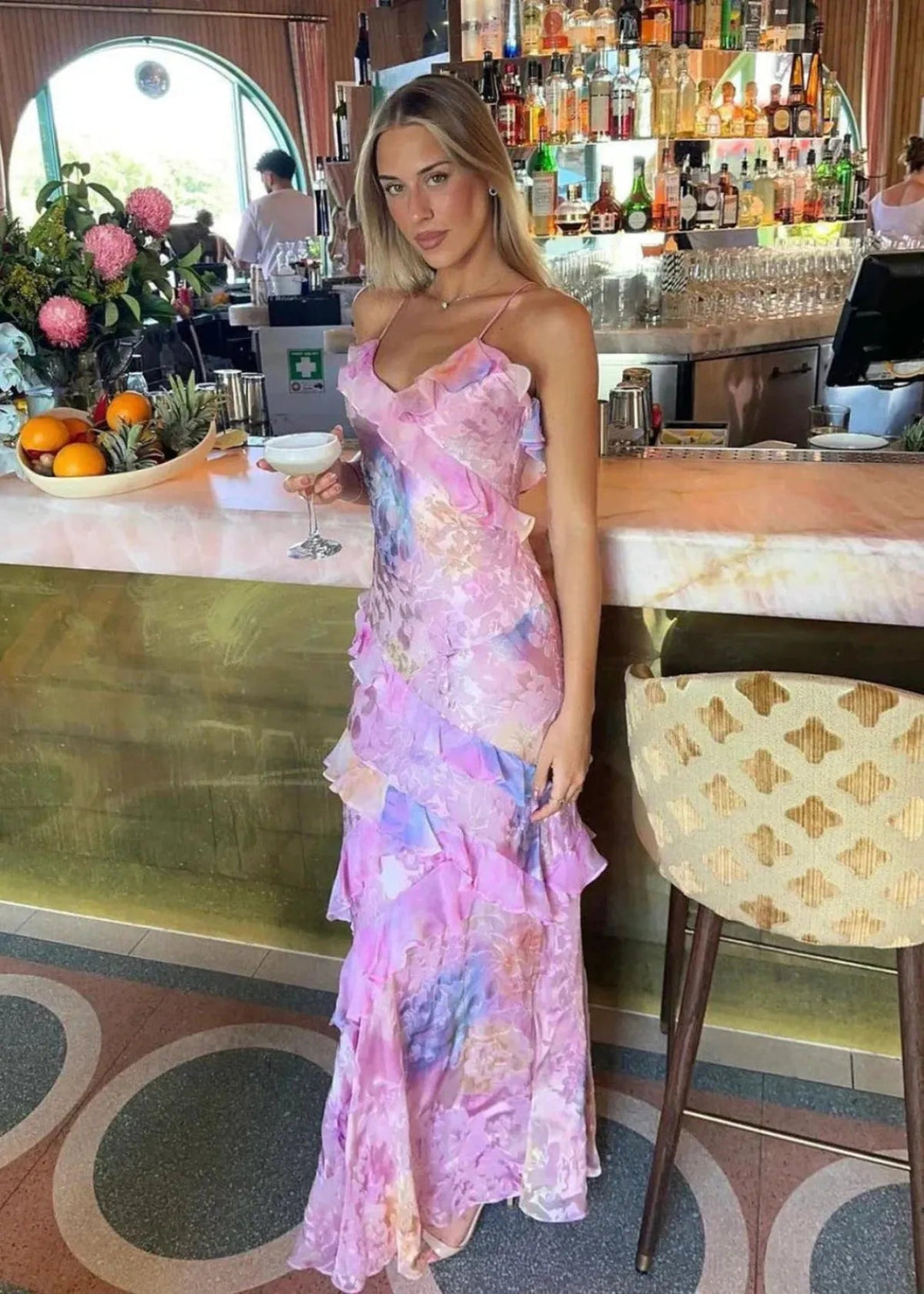 Flowy women's summer floral maxi dress with delicate spaghetti straps, elegant party style.