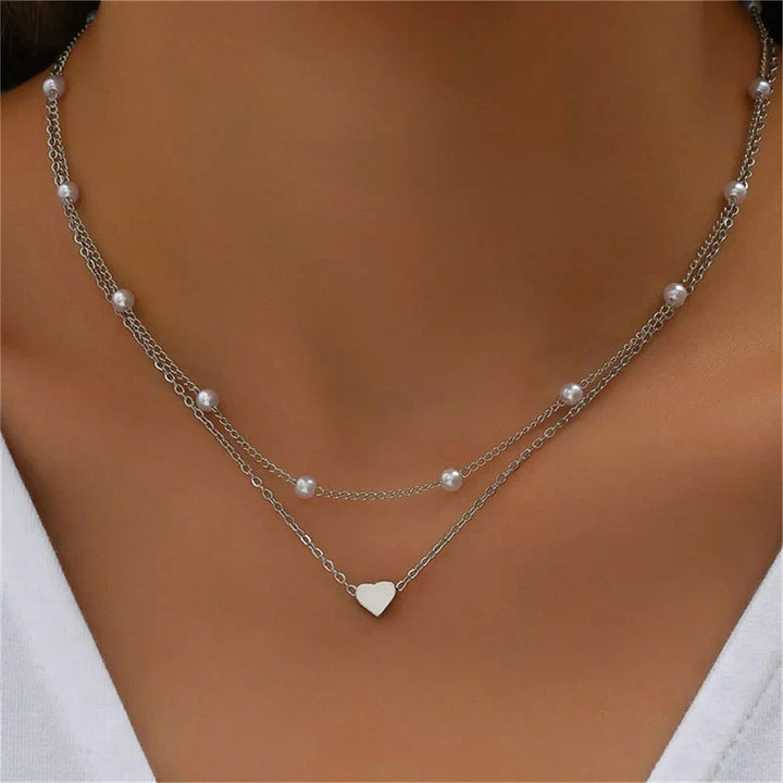 Versatile TriLevel layered necklace for women; choose gold or silver, heart or cross charm. Elegant & adjustable.