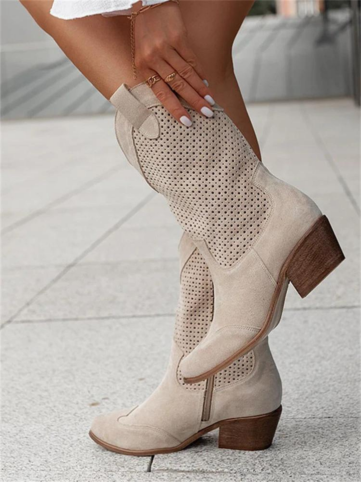 Elegant women's heeled western boots. Chic fashion cowgirl boots with a block heel, versatile for all year style.