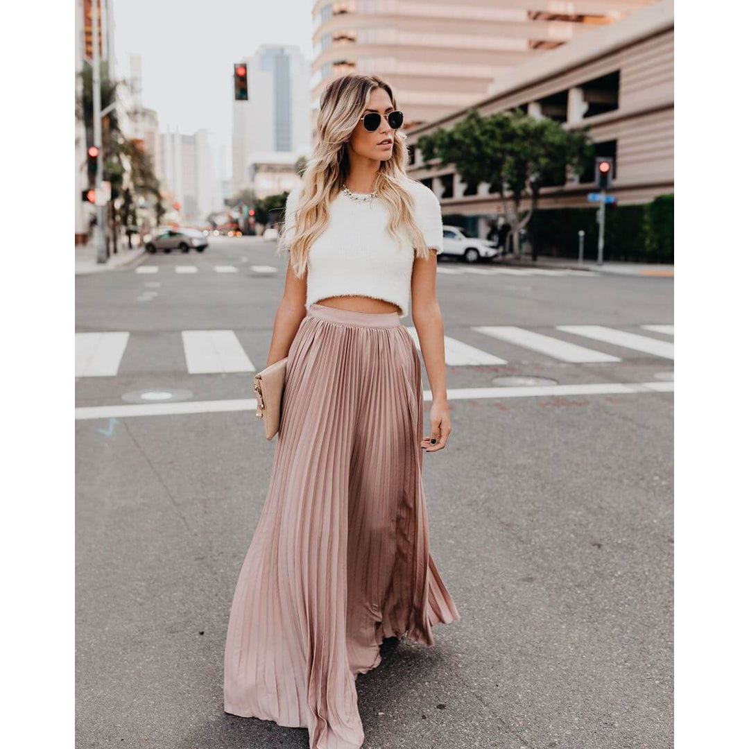 Chic women's high waist pleated long skirt, comfortable and flowy for versatile casual or elegant summer fashion.