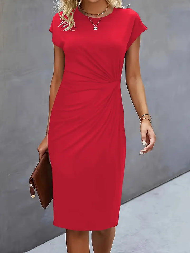Flattering women's workwear knee-length sheath dress, designed with a sophisticated ruched waist.