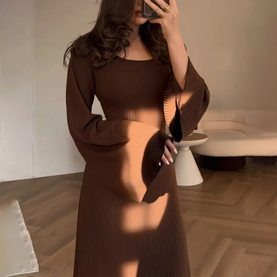 Elegant women's knit maxi dress with long sleeves, perfect for sophisticated formal or chic casual wear.