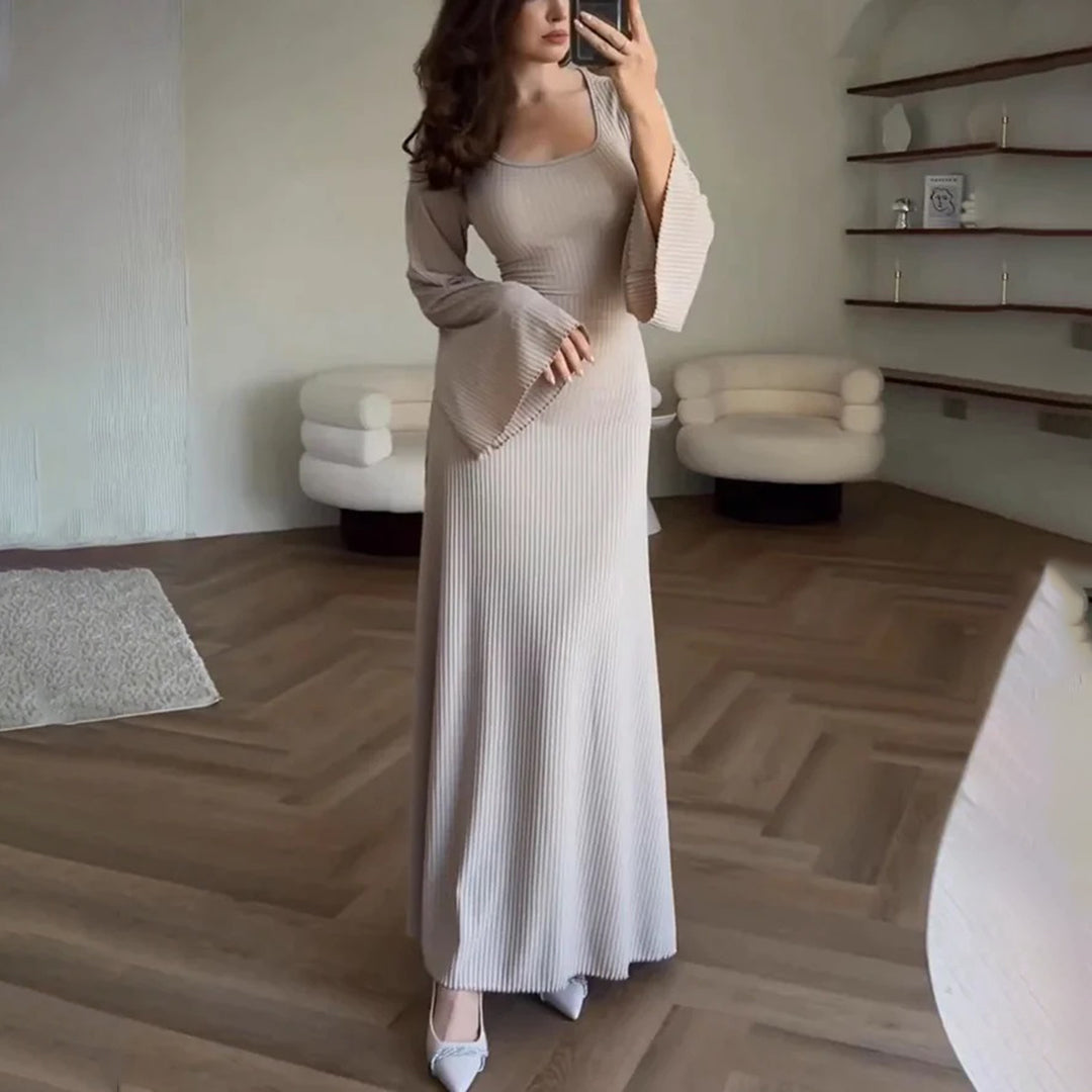 Stylish women's knit maxi dress with long sleeves in a rich color, perfect for elegant and formal occasions.