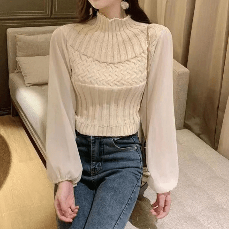 Comfortable women's knitted vest with delicate sheer sleeves for elegant autumn wear.