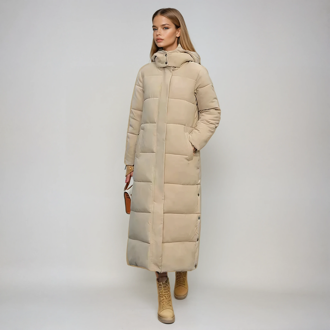 Elegant women's long beige puffer coat, providing chic warmth for winter & cold weather outerwear. Cozy fashion jacket.