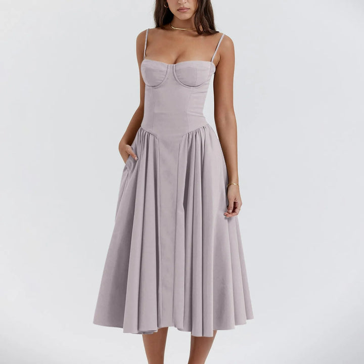 Timeless women's midi cocktail dress featuring an elegant corset bodice & a flowing pleated skirt.