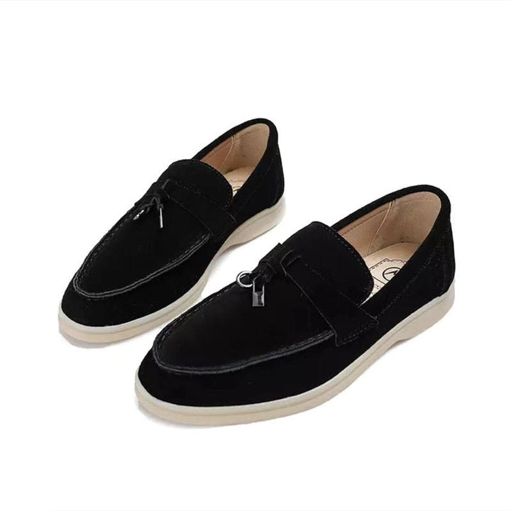 Modern pointed-toe women's loafers, versatile flats adding chic style to casual or formal ensembles.