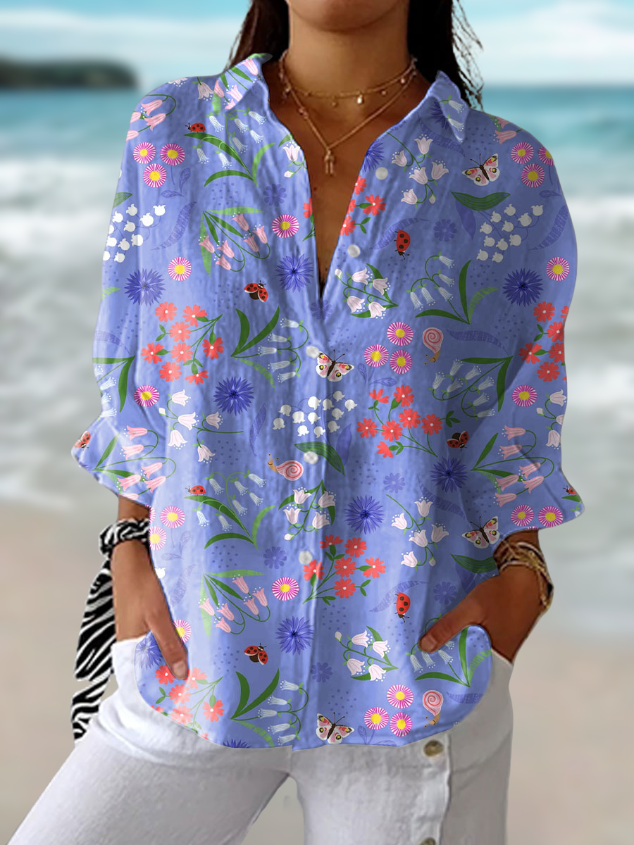 Elegant women's purple floral bloom meadow blouse, a flowy top perfect for spring and summer casual chic style.