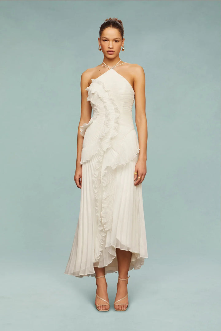 Model wearing a graceful women's ruffle halter maxi dress, showcasing its elegant flow and design.