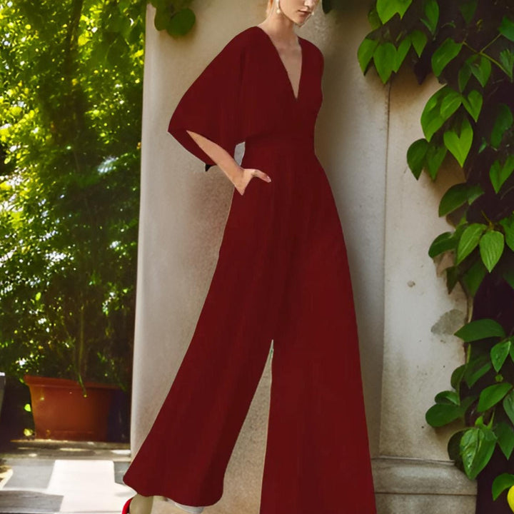 Comfortable V-neck jumpsuit for women, featuring three-quarter sleeves for stylish summer outfits. Versatile Aurora Chic.