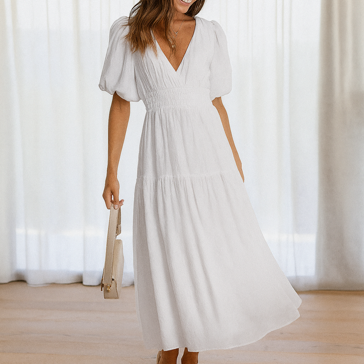 Comfortable, flowy V-neck midi dress for women with elastic waist, ideal for casual daytime wear.
