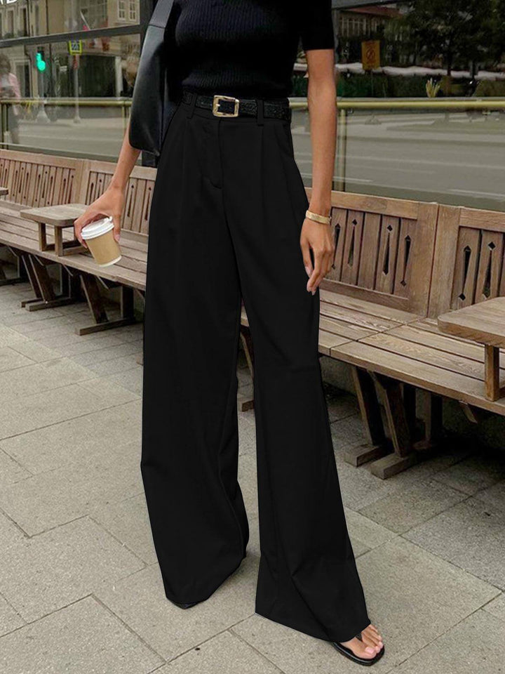 Comfortable women's wide-leg pleated trousers, high-waisted design for effortless elegance.