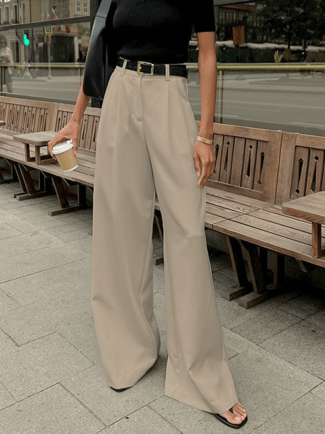 Women's elegant high-waist pleated wide-leg trousers, a modern fashion statement.