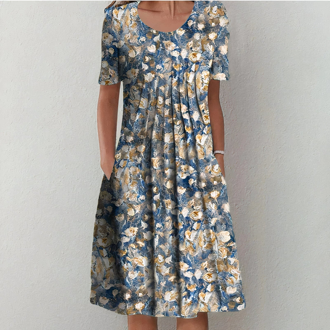 Elegant women's midi dress for spring and summer, featuring a mid-length hem and playful swing, ideal for warm days.
