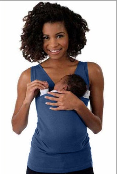 Parent carrying an infant in the modern, ergonomic CarryEase baby sling t-shirt for daily activities.