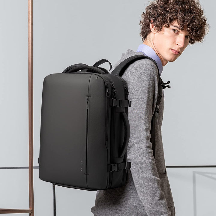 Versatile waterproof travel backpack for business trips. Features laptop sleeve & anti-theft design.