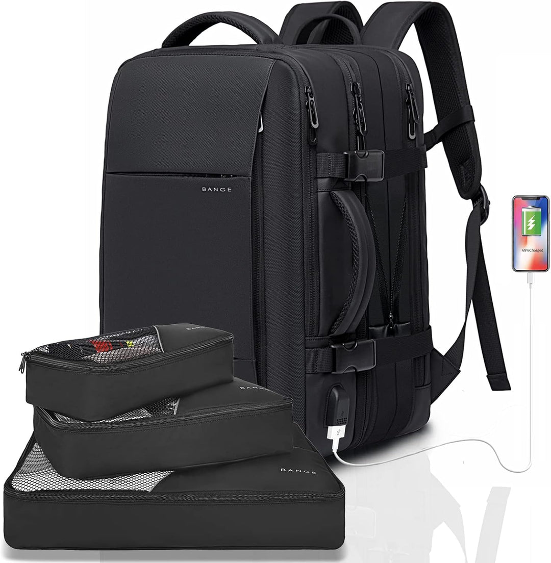 Waterproof travel backpack placed next to a laptop, highlighting the dedicated sleeve.