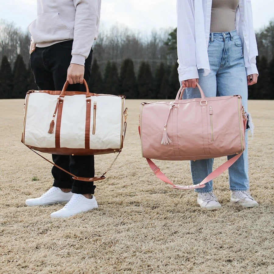 "Foldable smart carry-on bag with sleek design, multi-compartment storage, vegan leather, and garment cover for travel."