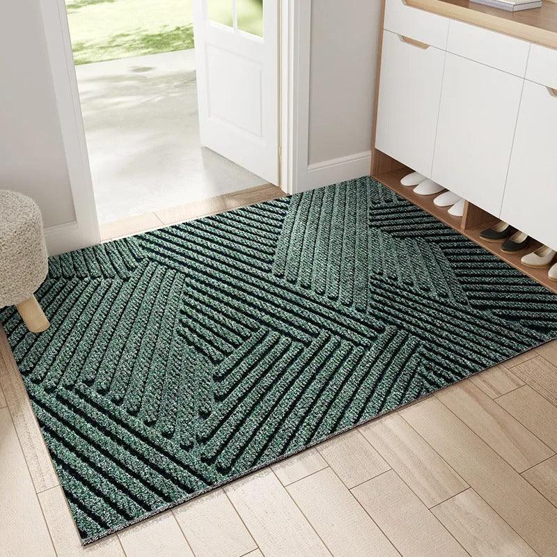 "Green non-slip heavy-duty door mat with textured surface for indoor/outdoor use, resists dirt, rain, and sun exposure."