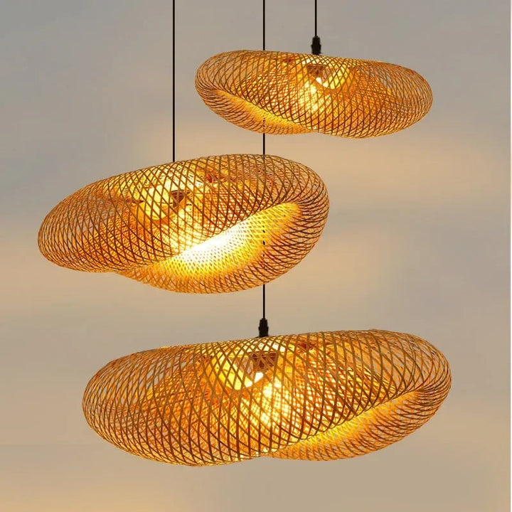"Handcrafted bamboo pendant light with wave-pattern wicker rattan shade, adds warm, natural elegance to any interior space."
