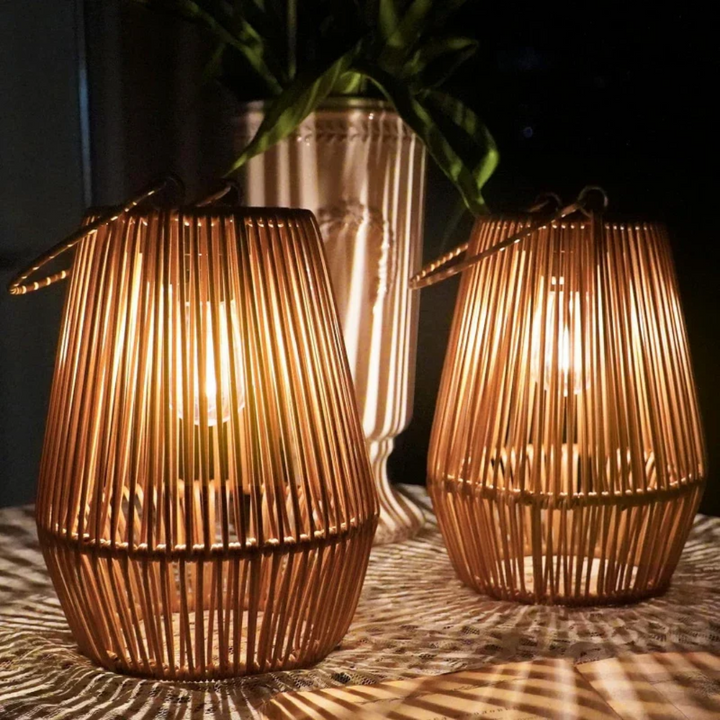 Handwoven solar garden lamp with intricate design, LED light, and waterproof finish, perfect for sustainable outdoor decor.