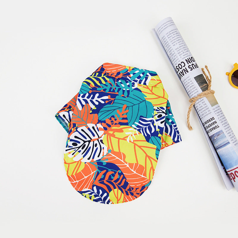 Hawaiian dog shirt with vibrant tropical patterns, featuring pineapples and foliage in bold colors for pet summer style.