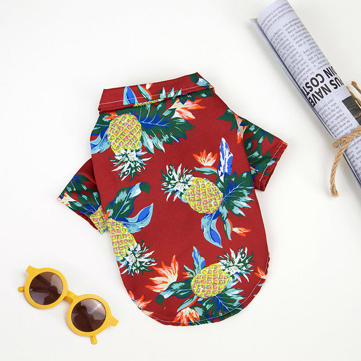 Hawaiian dog shirt with vibrant tropical patterns, featuring pineapples and foliage in bold colors for pet summer style.