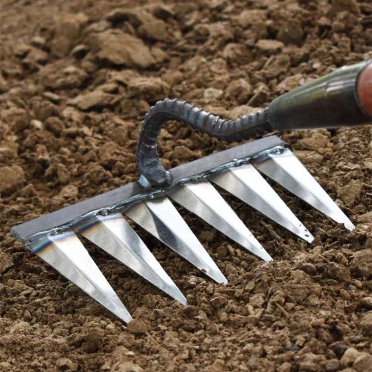"Heavy-Duty Lawn Rake with stainless steel tines for weeding; angled V-shaped tines, durable garden maintenance tool."