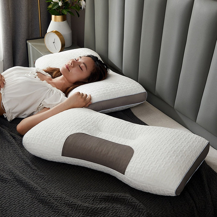 Hybrid pillow with ergonomic design, suited for back and side sleepers, featuring a neutral aesthetic and neck support.
