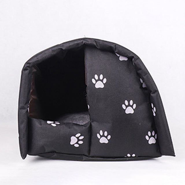 "Insulated waterproof outdoor cat house with all-weather protection, cozy interior, and removable cushion for easy cleaning."
