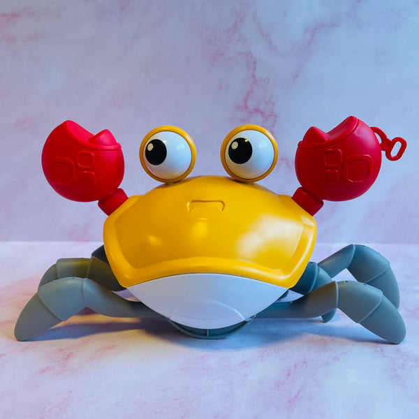 Interactive dancing crab toy for dogs with vibrant colors, glowing eyes, and musical features to engage pets in active play.