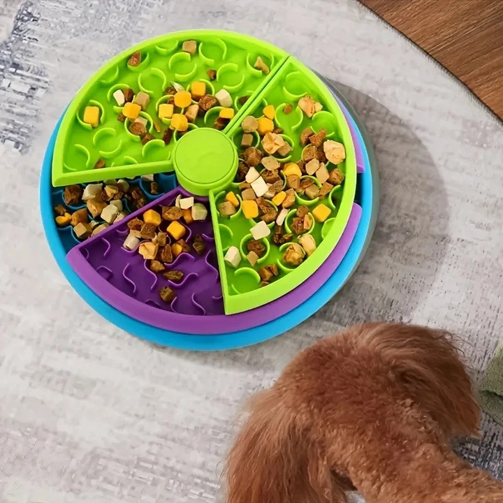 "Interactive dog feeder with rotating levels, featuring colorful sections and sturdy design to aid in slower, mindful eating.