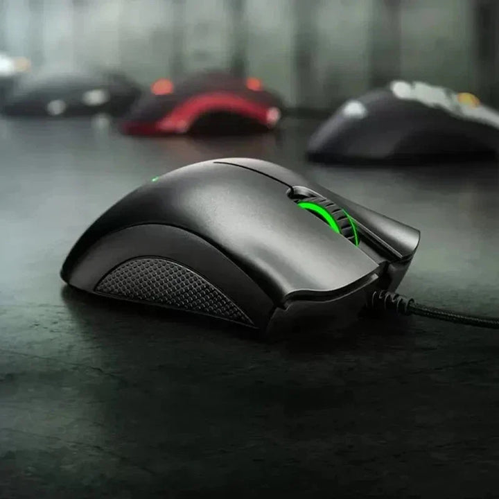"Jet Black ergonomic optical gaming mouse with contoured design, precision 6,400 DPI sensor, and responsive buttons for gamer