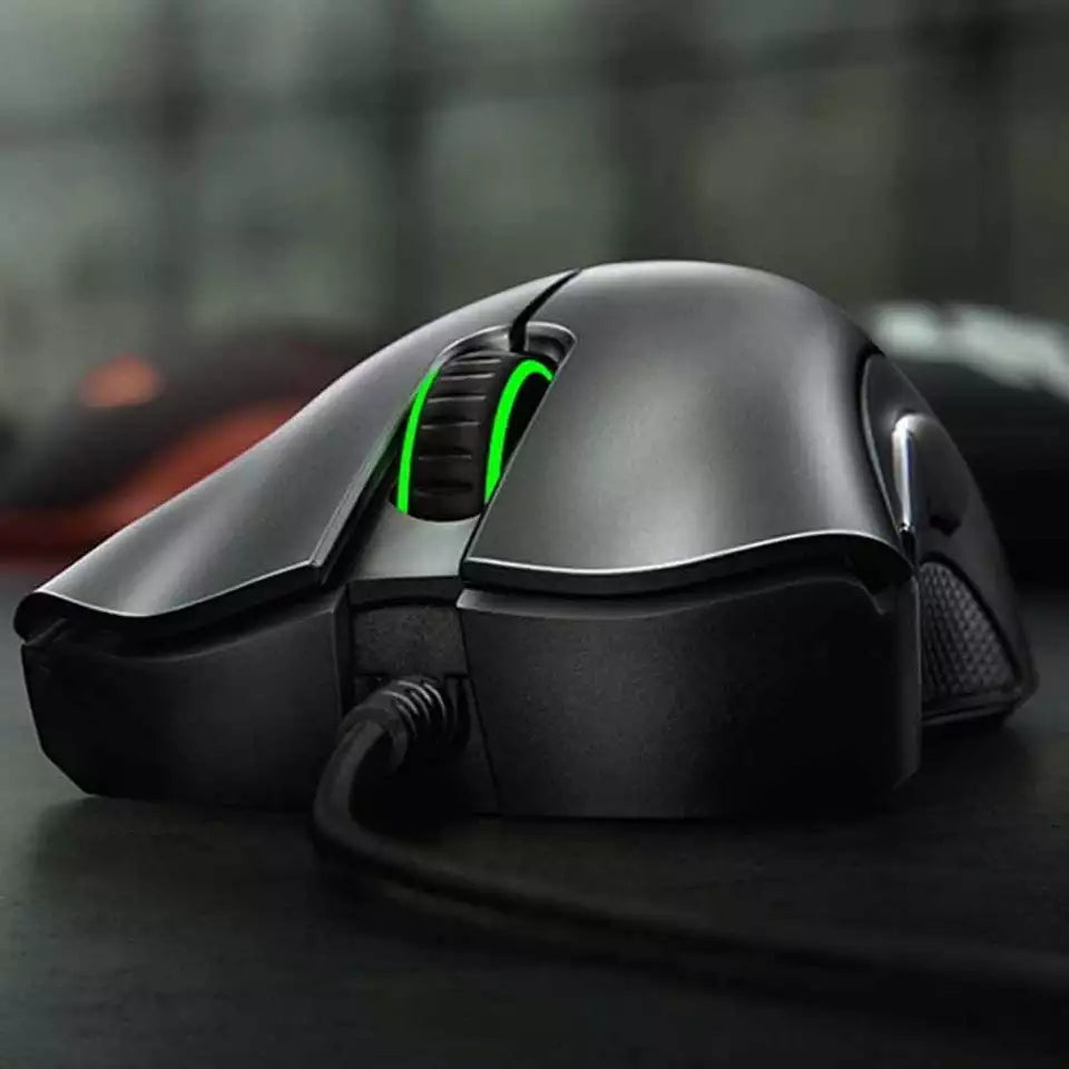 "Jet Black ergonomic optical gaming mouse with contoured design, precision 6,400 DPI sensor, and responsive buttons for gamer
