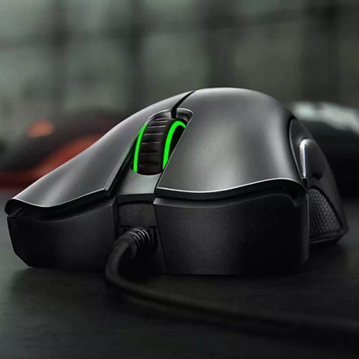 "Jet Black ergonomic optical gaming mouse with contoured design, precision 6,400 DPI sensor, and responsive buttons for gamer