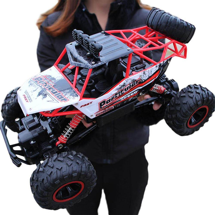 All-terrain RC toy truck in action on rough terrain, showcasing 4WD and durability for kids.
