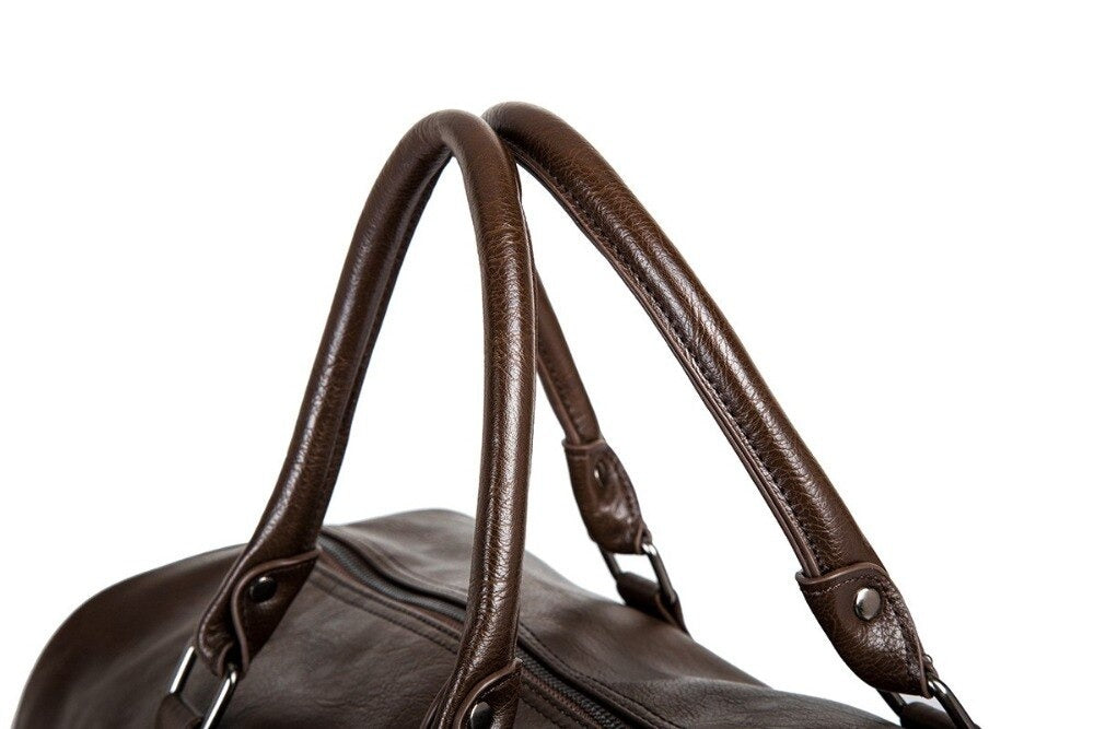 Timeless large leather duffel bag. Lightweight and durable, perfect for carry-on travel essentials.