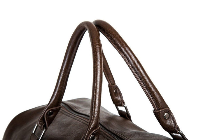 Timeless large leather duffel bag. Lightweight and durable, perfect for carry-on travel essentials.