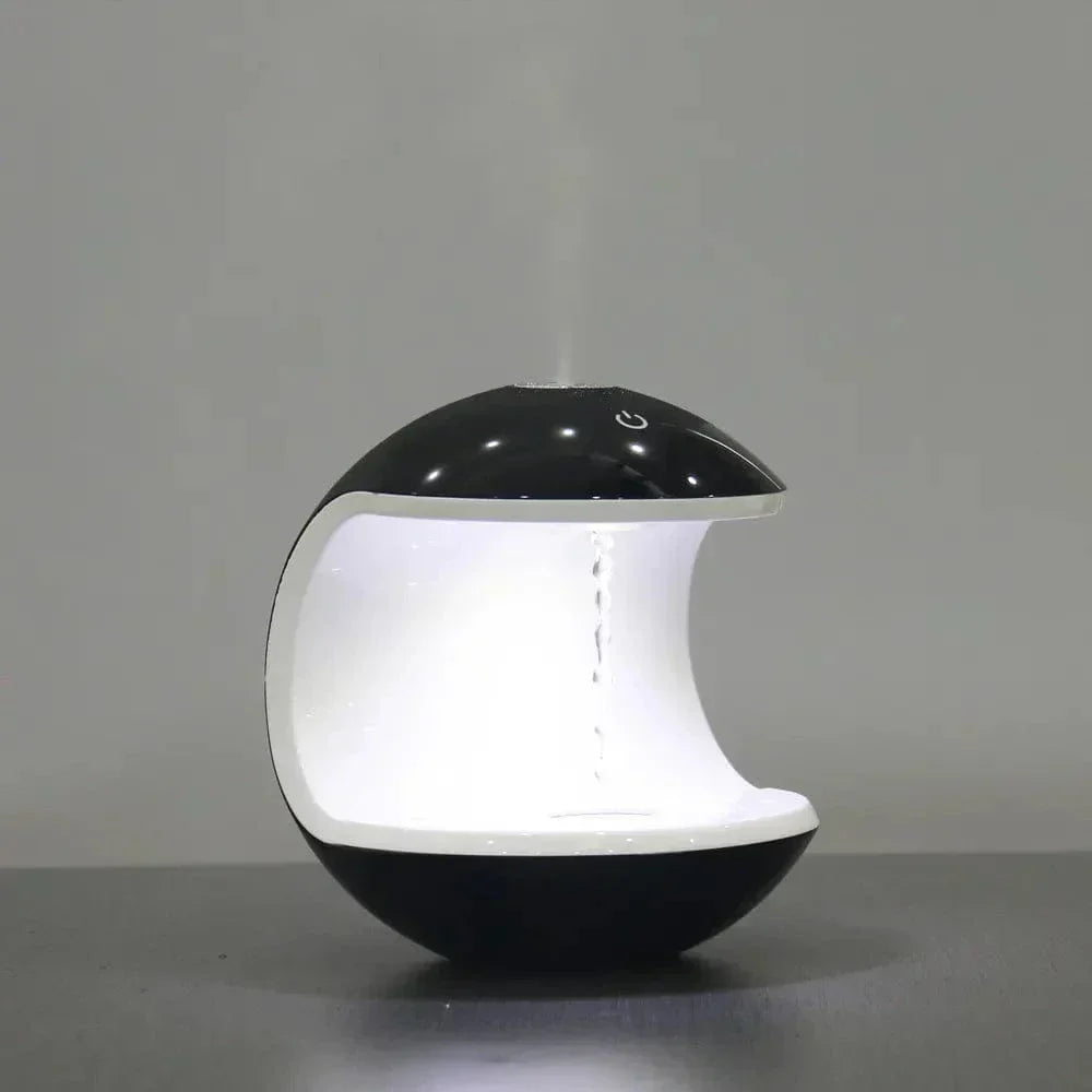 "Levitating Water Droplet Ultrasonic Humidifier with LED light, showing floating droplets effect, perfect for modern decor."