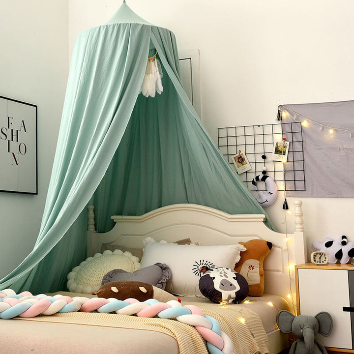 "Light green children's blackout bed canopy; elegant polyester fabric; blocks light; ideal for cribs, creating a cozy vibe."