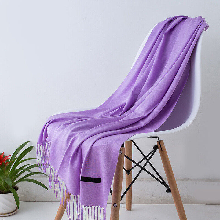 Elegant women's Bria cashmere wrap scarf, long, soft, and stylish for luxurious warmth.