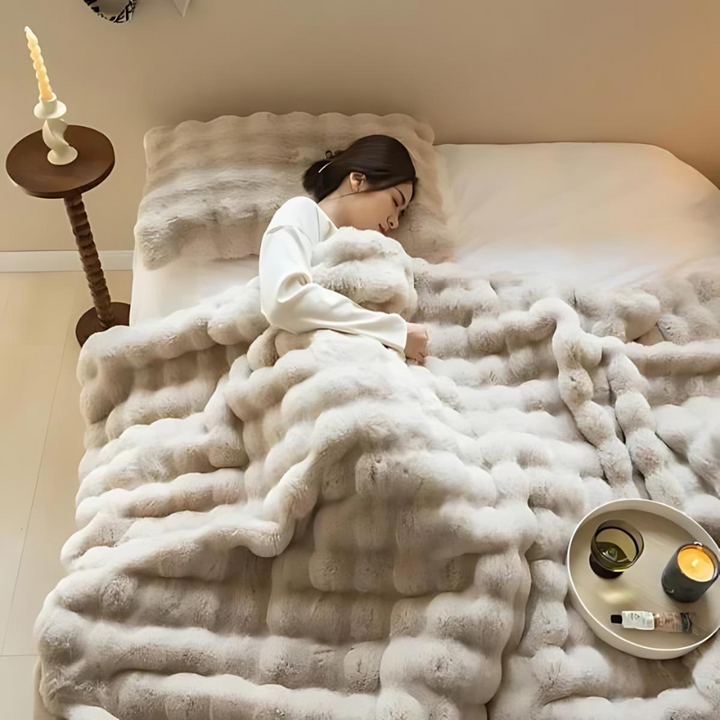 "Luxurious double-sided fleece and faux fur blanket for ultimate warmth, soft texture; ideal bedding or decorative throw."