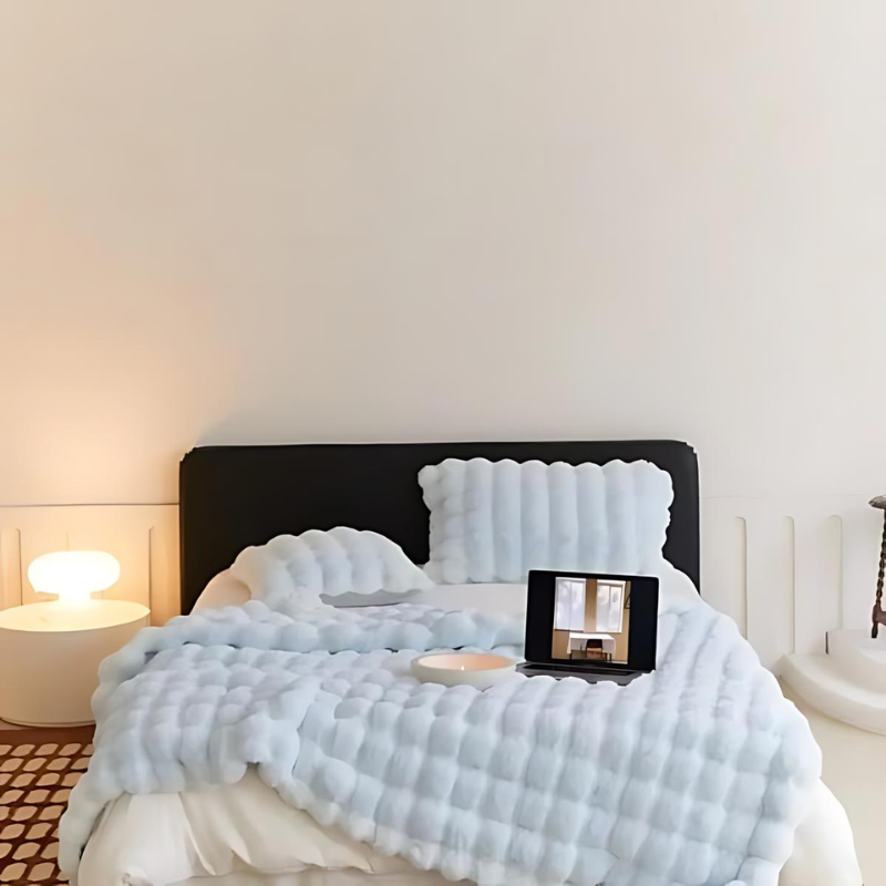 "Luxurious double-sided fleece and faux fur blanket for ultimate warmth, soft texture; ideal bedding or decorative throw."