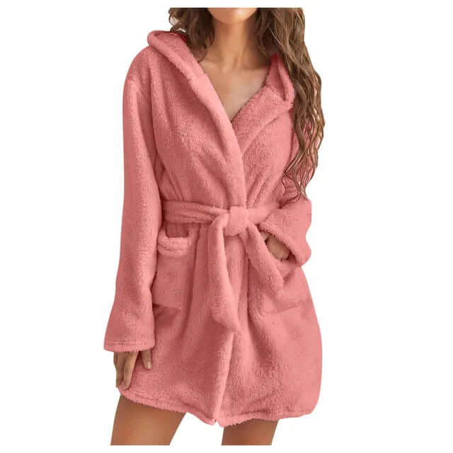 Indulge in a warm, plush women's hooded bathrobe. Cozy fleece for ultimate comfort & relaxation.