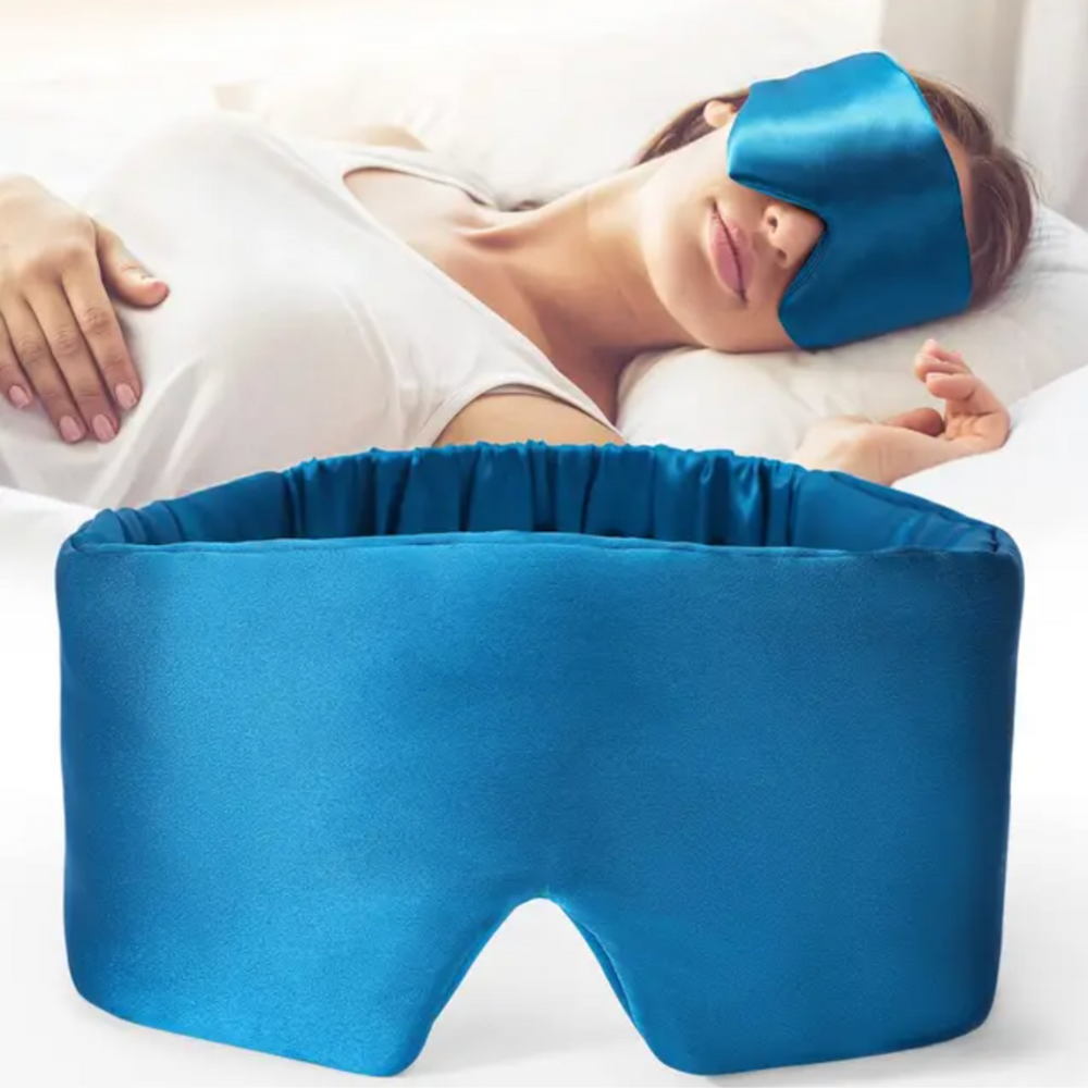 Luxurious unisex silk sleep mask, blocks 100% light; shown in elegant black with adjustable strap for comfortable wear.