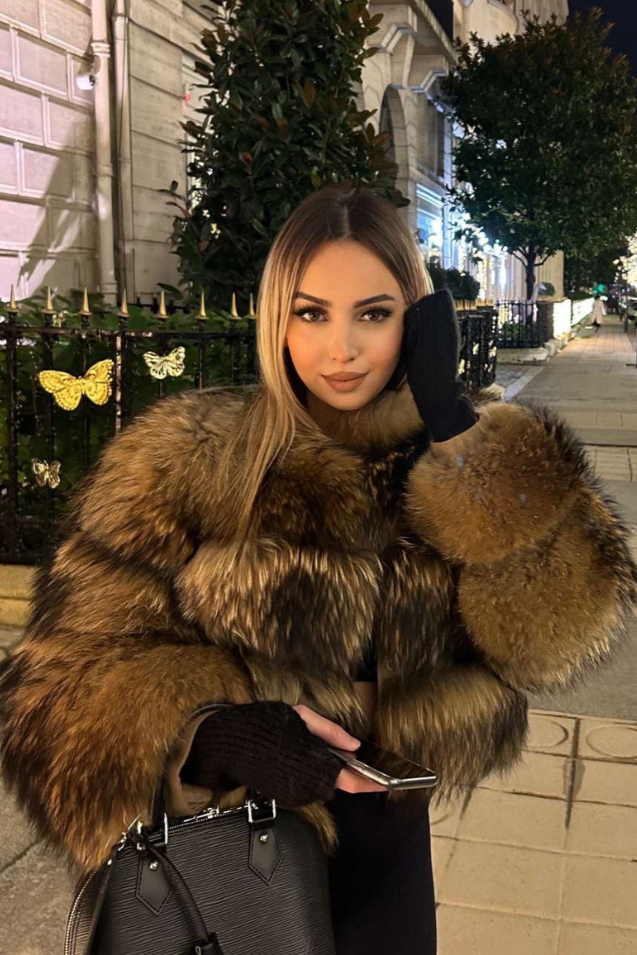 Chic brown women's plush jacket, a luxurious statement piece for stylish winter outerwear and warmth.