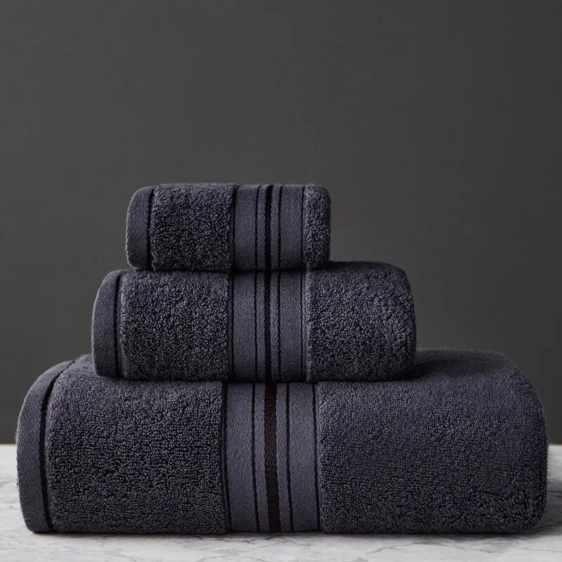 Neatly folded luxury Egyptian cotton bath towel set, ideal for elegant bathroom decor & essential daily use.