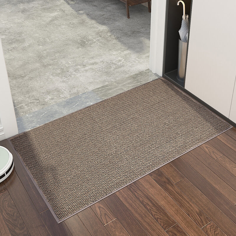 Machine washable woven indoor door mat with a timeless weave pattern, non-slip backing, and plush polypropylene surface.
